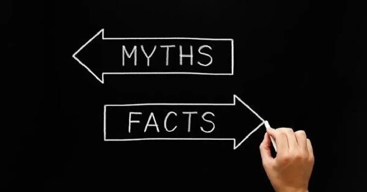 Hand drawing opposite arrows with text on them as "Myths"and "Facts"