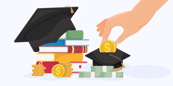 a hand putting a coin into a graduation cap